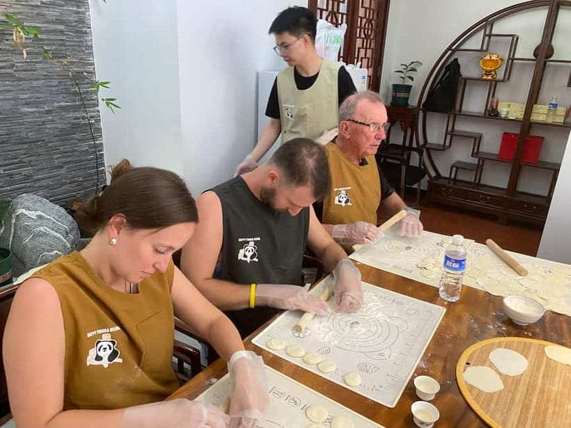 Beijing: Dumpling Making Workshop with Meal and Tea - The communal dinner: generous portions and real pairing with tea and beer