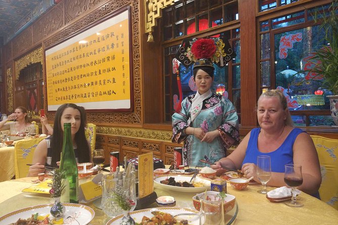 Beijing Imperial Dining Experience at Bai Jia Da Yuan Restaurant with Houhai Lake Bar Tour - The night drive: illuminated Bird’s Nest, Water Cube, and towers
