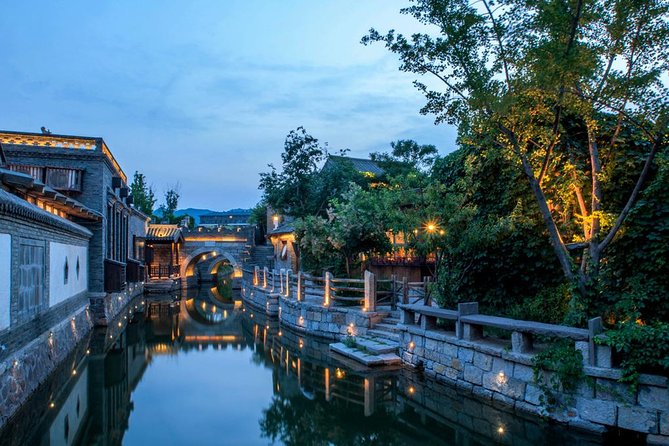 Private Evening Tour to Simatai Great Wall and Gubei Water Town - Gubei Water Town at night: fountains, light show, and easy strolling