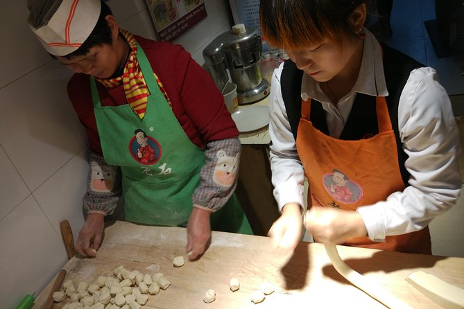 Private Hutong Culture Tour with Dumpling Cooking Class plus Cricket Fighting Game - Drum Tower panoramas and the walk to Yandaixiejie Hutong and Houhai