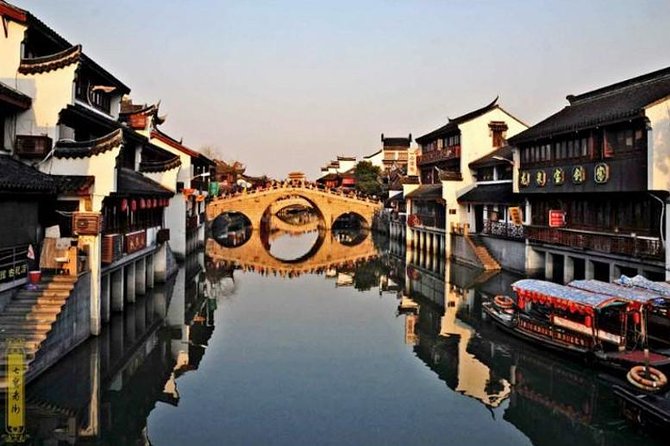 Private Qibao Ancient Town Walking Tour with Tea Tasting and Calligraphy Experience - Price and Logistics: Private Pickup, Local Transport, Real Time Budget