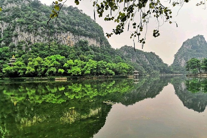Seven Star Crags Karst Cave Mirror Lake Bird Islands Private Tour - Dinghu Mountain: forest air, shuttle ride, and a paddle boat on the water