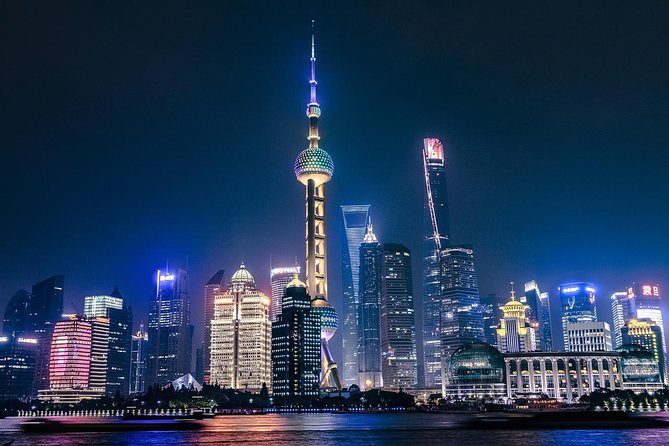 Shanghai Authentic Dinner and Night River Cruise with Rooftop Bar Hopping Option - Stop 1: Dinner at a local restaurant with soup dumplings and custom options