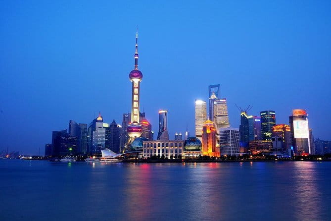 Shanghai by Night with Fine Local Dinner and VIP River Cruise Experiences - Hotel pickup and a real local guide who handles the details