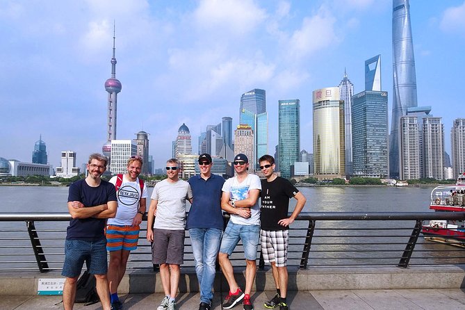 Shanghai Day Tour to Zhujiajiao Water Town, Yu Garden, Bazaar, Bund - Comfort and logistics: pickup, vehicle, water, and umbrellas