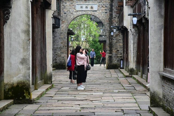 Wuzhen and Xitang Water Town Private Full Day Trip from Shanghai with Lunch and Dinner - Wuzhen Water Town: bridges, canals, and a boat cruise