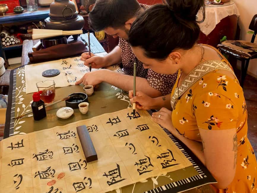 Xi'an Chinese Calligraphy Workshop: Ink Art & Tea Tasting - Practice session: writing dragon power, martial spirit, and love