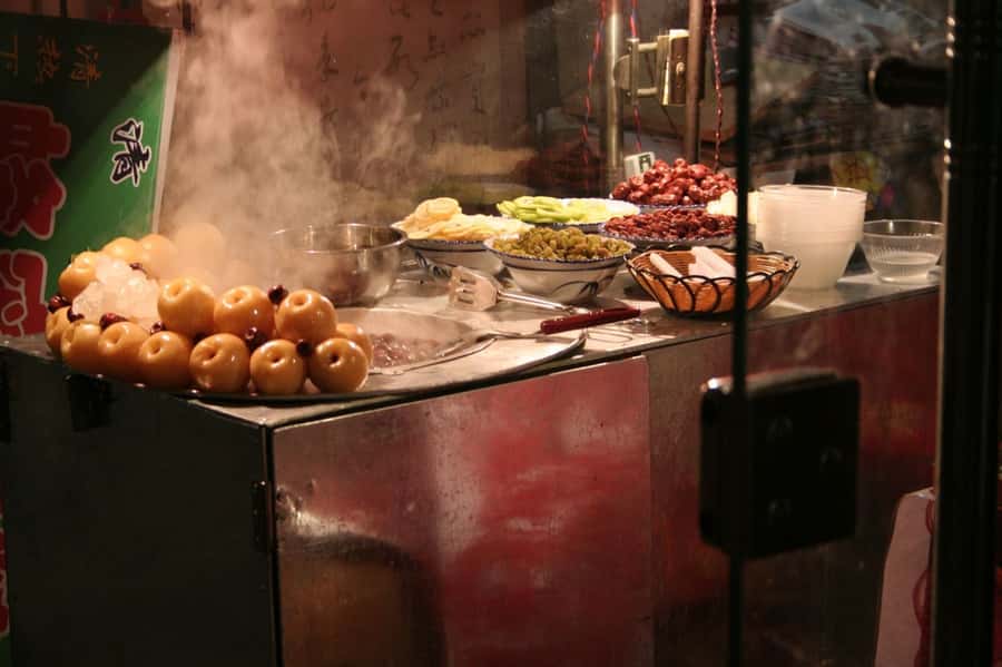 Xi'an: Gourmet & Street Food Tour - Bell Tower start, then you shift from landmark photos to food focus