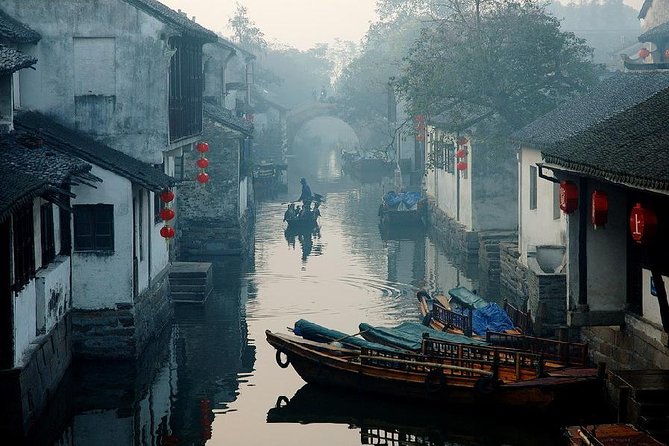 Xitang Water Village Sunset Tour with Riverside Dining Experience from Shanghai - Entering Xitang after sunset: lantern lanes, alleys, and that corridor walk